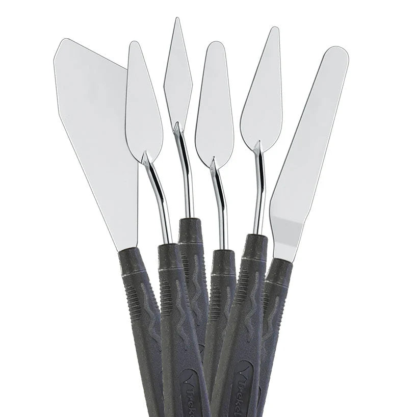 Five silver palette knives with black handles and assorted pointed, oval and angular blades.