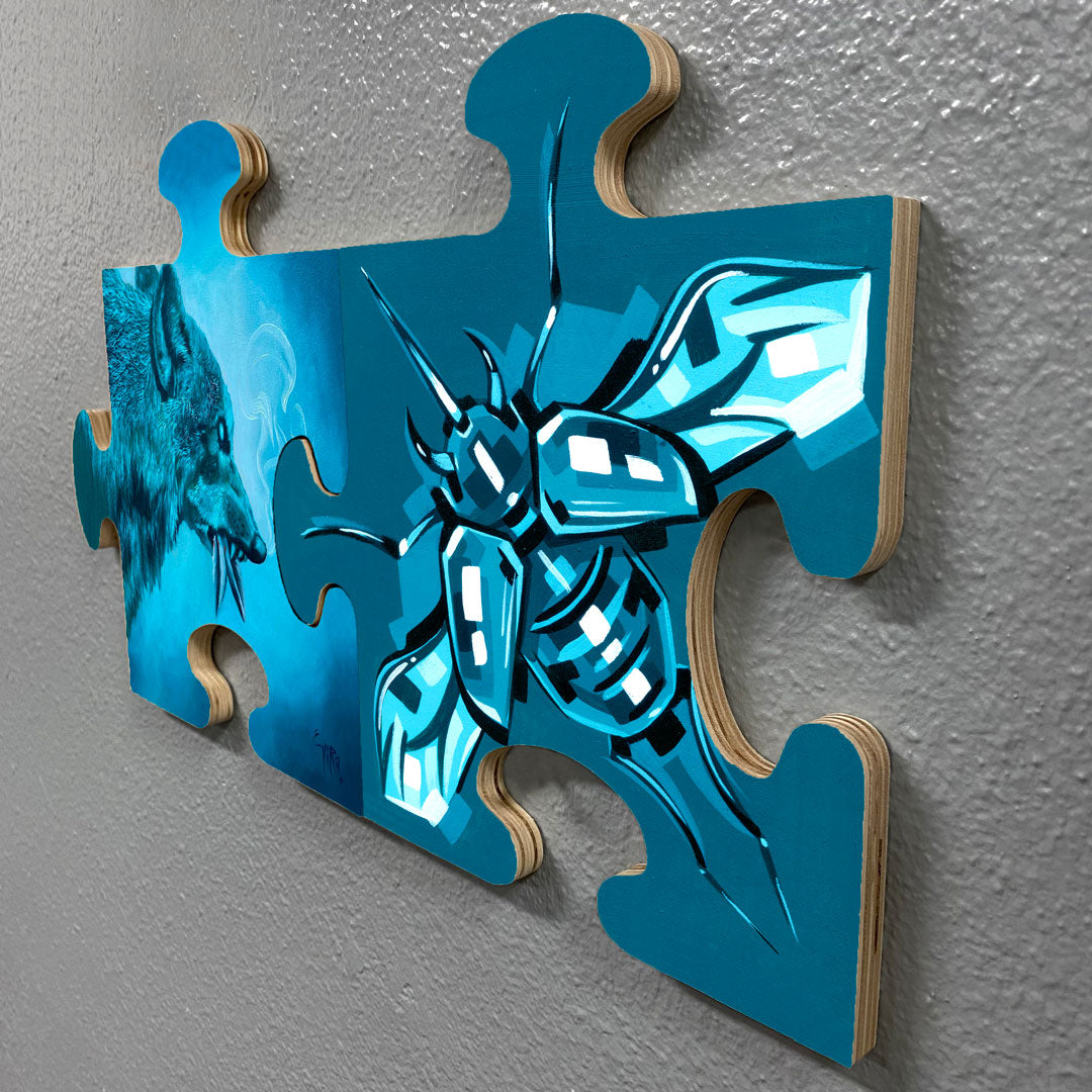 Three blue puzzle-piece panels painted with a faceted turquoise bee and matching abstract shapes.