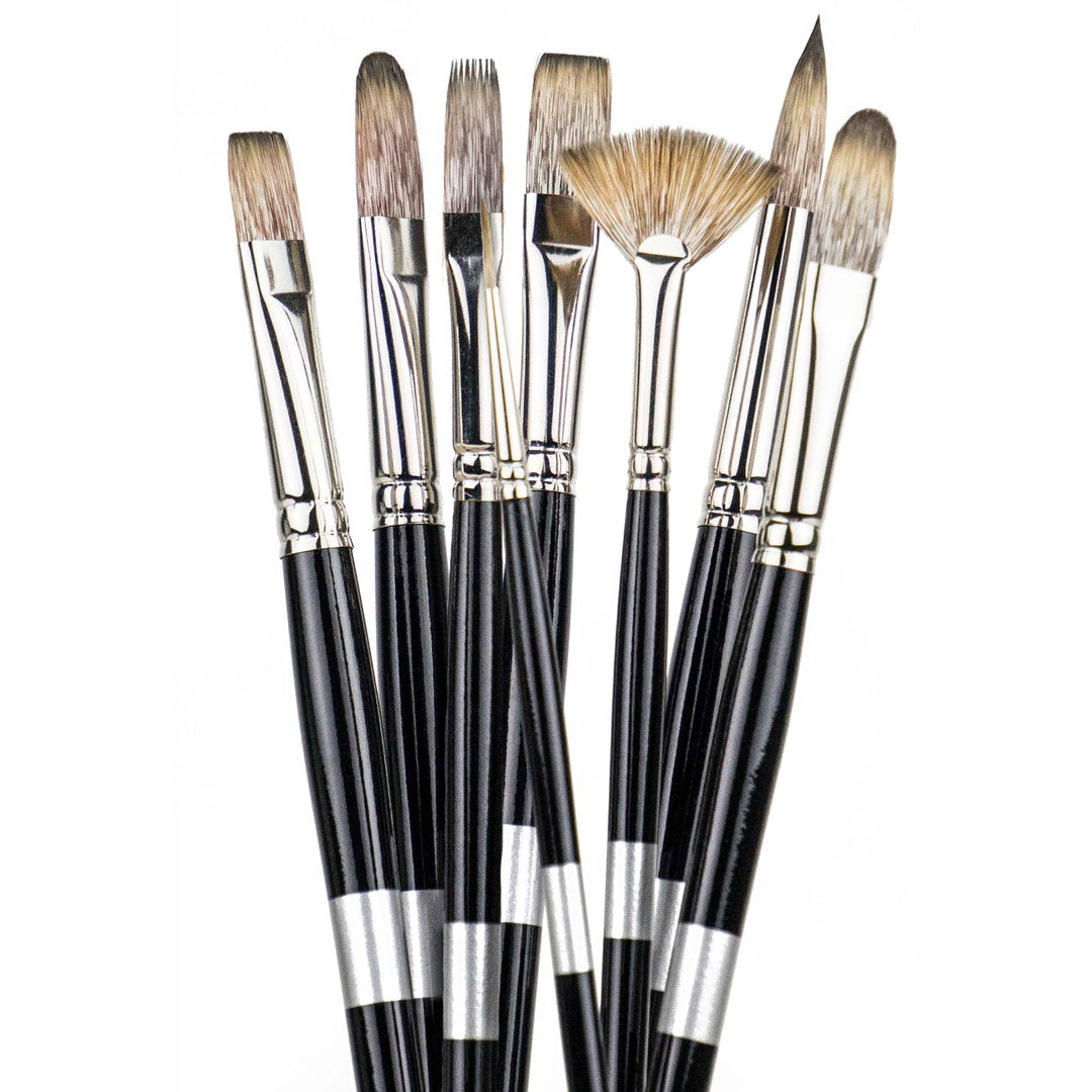 Eight black-handled brushes fanned upright with brown flat, pointed, rounded and fan-shaped bristles.
