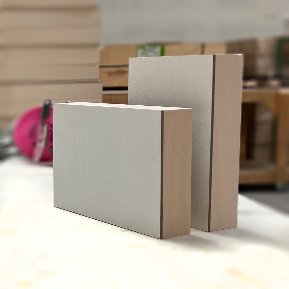Two white rectangular panels standing upright, showing different depths.