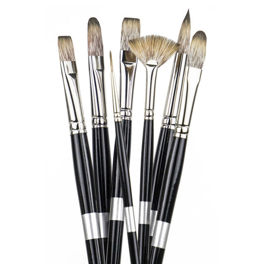 Eight brown-bristled black-handled brushes fanned upright, including a fan brush.