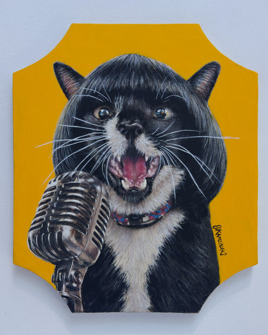 Black-and-white cat with open mouth beside a striped microphone against yellow.