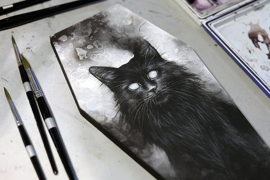 Watercolor paper being mounted onto a wood panel.