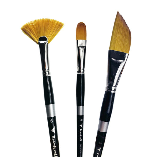 Three brushes show golden fan, rounded and angled tips.