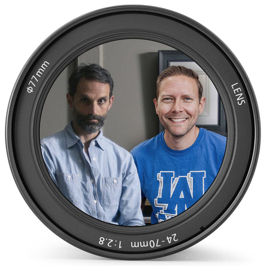 Circular lens graphic frames two men's portraits, one wearing a blue shirt.