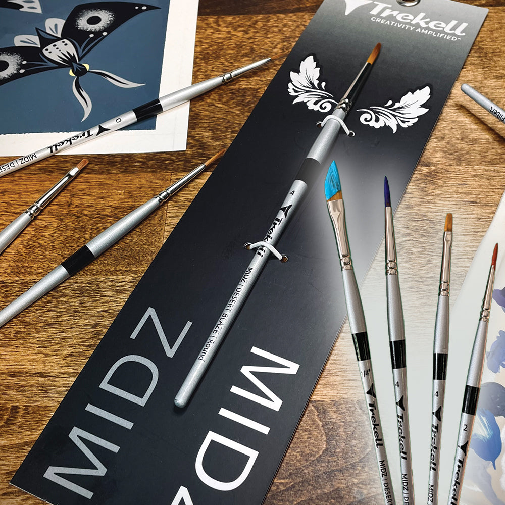 Black MIDZ brush packaging beside fine brushes on a wooden surface.