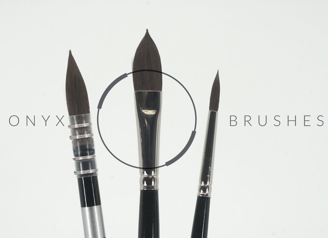 Three dark pointed brushes beneath faint Onyx Brushes lettering.