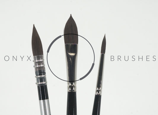 Three dark pointed brushes beneath faint Onyx Brushes lettering.