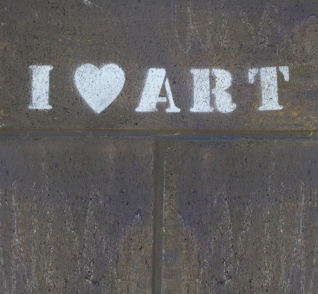 White I heart ART lettering on a dark textured background.