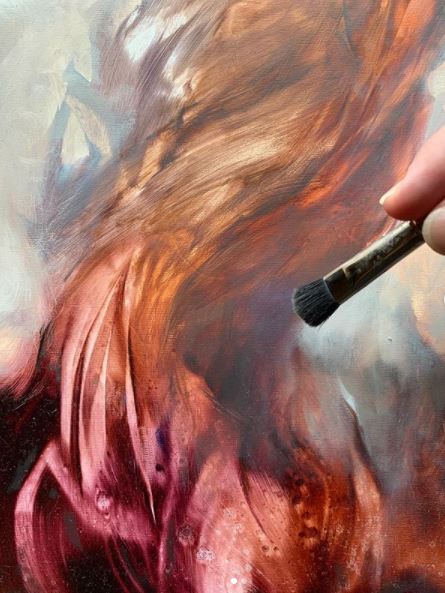 Brush touches flowing orange-and-red hair in a textured painting.