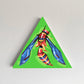 Red-and-yellow winged insect painted on a green triangular panel.