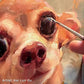 Fine brush adds detail near the eye of a cream-and-brown dog's painted face.