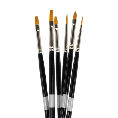 Six black-handled brushes fanned upright with flat, angled and pointed golden tips.