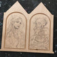 Pencil drawings of a long-haired woman and a skeleton on the two arched sections of a gable diptych panel.