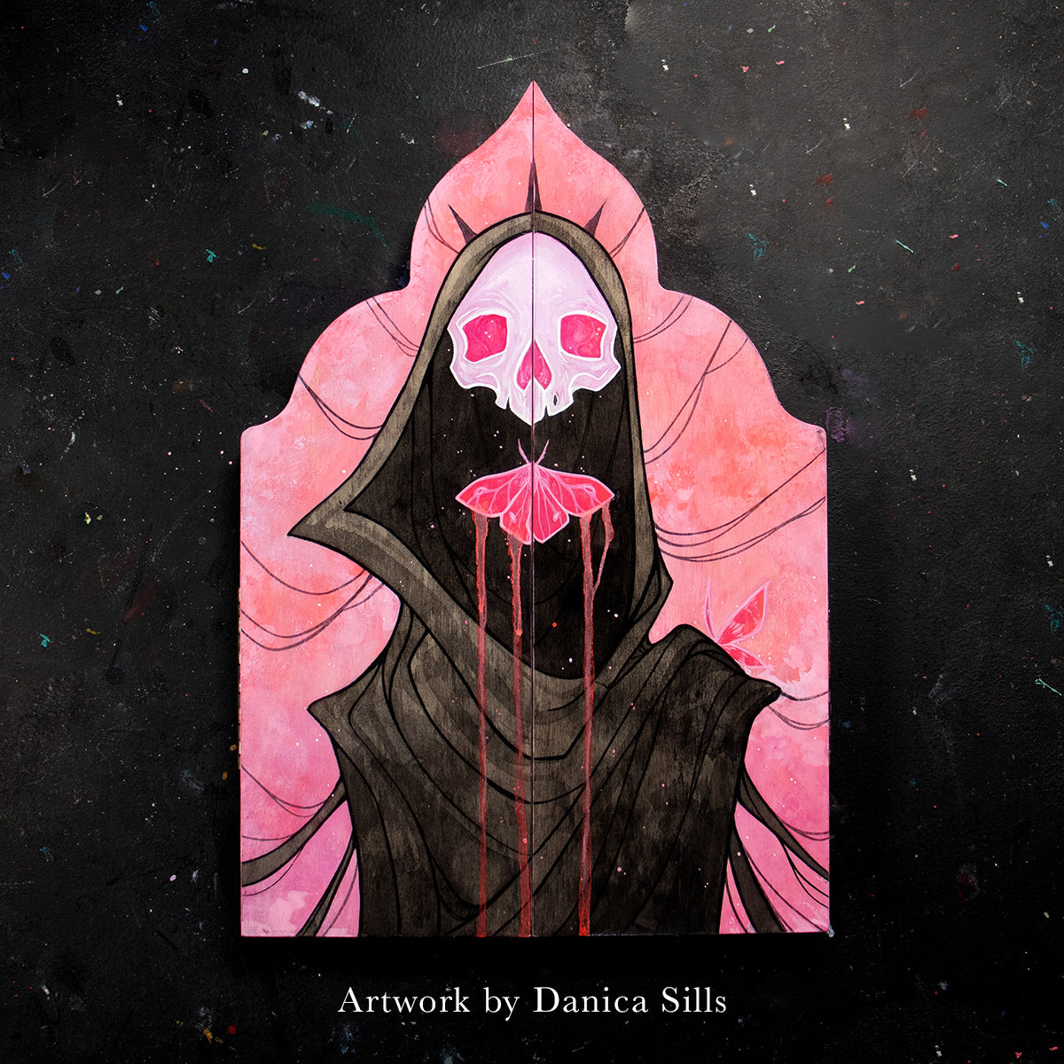 Pink skull above a black cloaked figure on a pink Gothic Cathedral altar panel, credited to Danica Sills.
