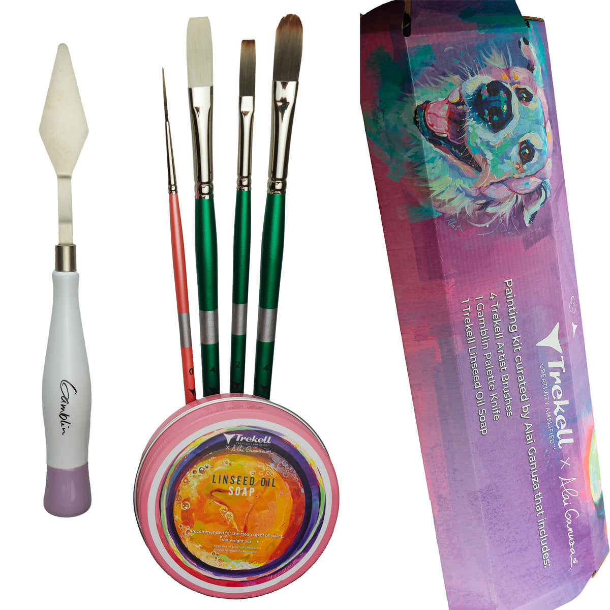 Four green-handled brushes, a palette knife and a soap tin beside a purple illustrated box.