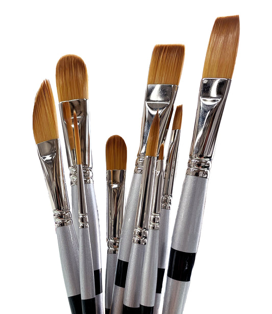 Six black-handled brushes with broad golden flat and rounded tips fanned close together.