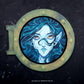 Blue-haired woman's face in a green porthole frame, credited to Danica Sills.