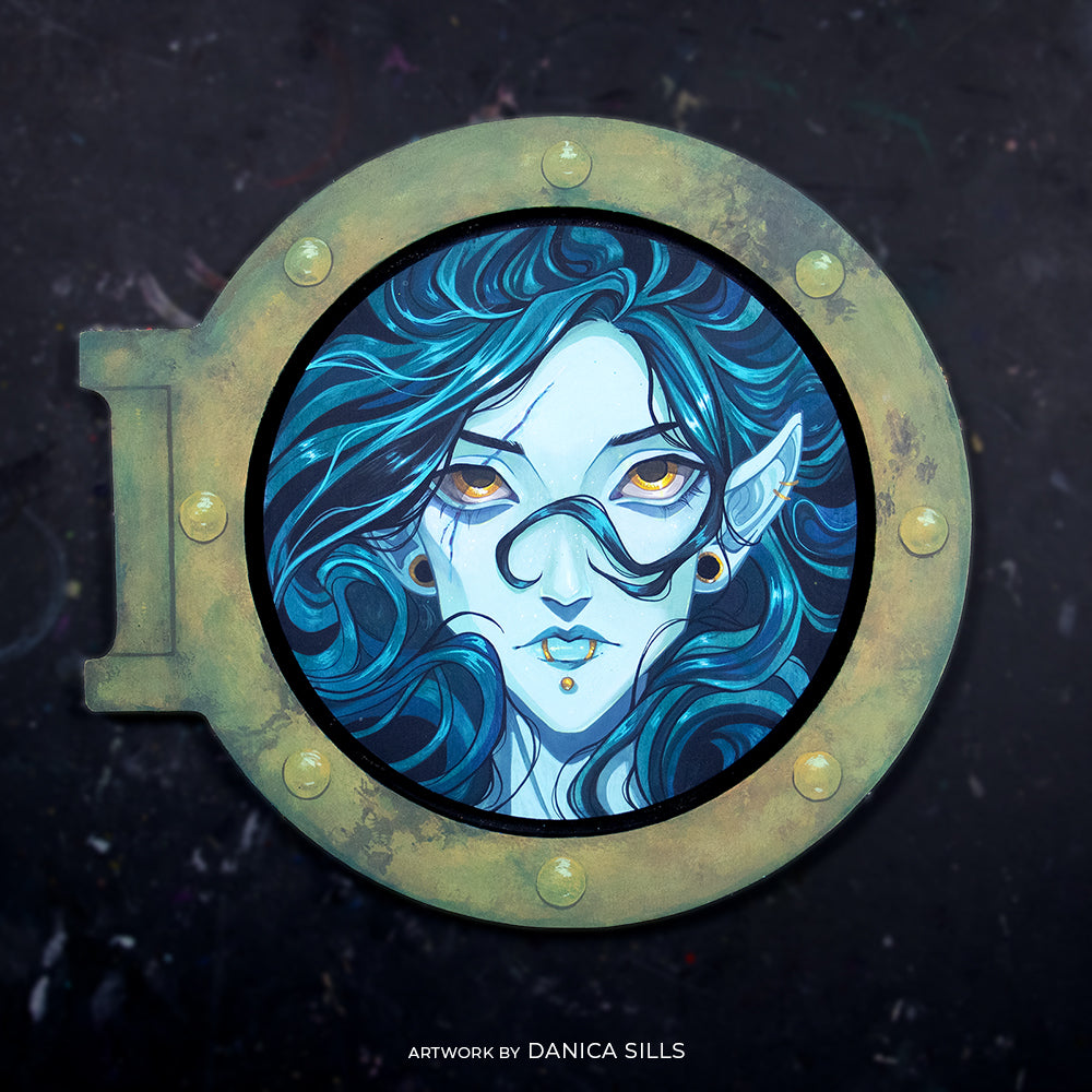 Blue-haired woman's face in a green porthole frame, credited to Danica Sills.