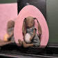 Pink egg-shaped panel painted with a seated elephant-headed figure, credited to Eric Johnson.