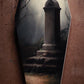 Stone monument beneath bare trees in a misty graveyard painted on a coffin panel, credited to Eric Johnson.