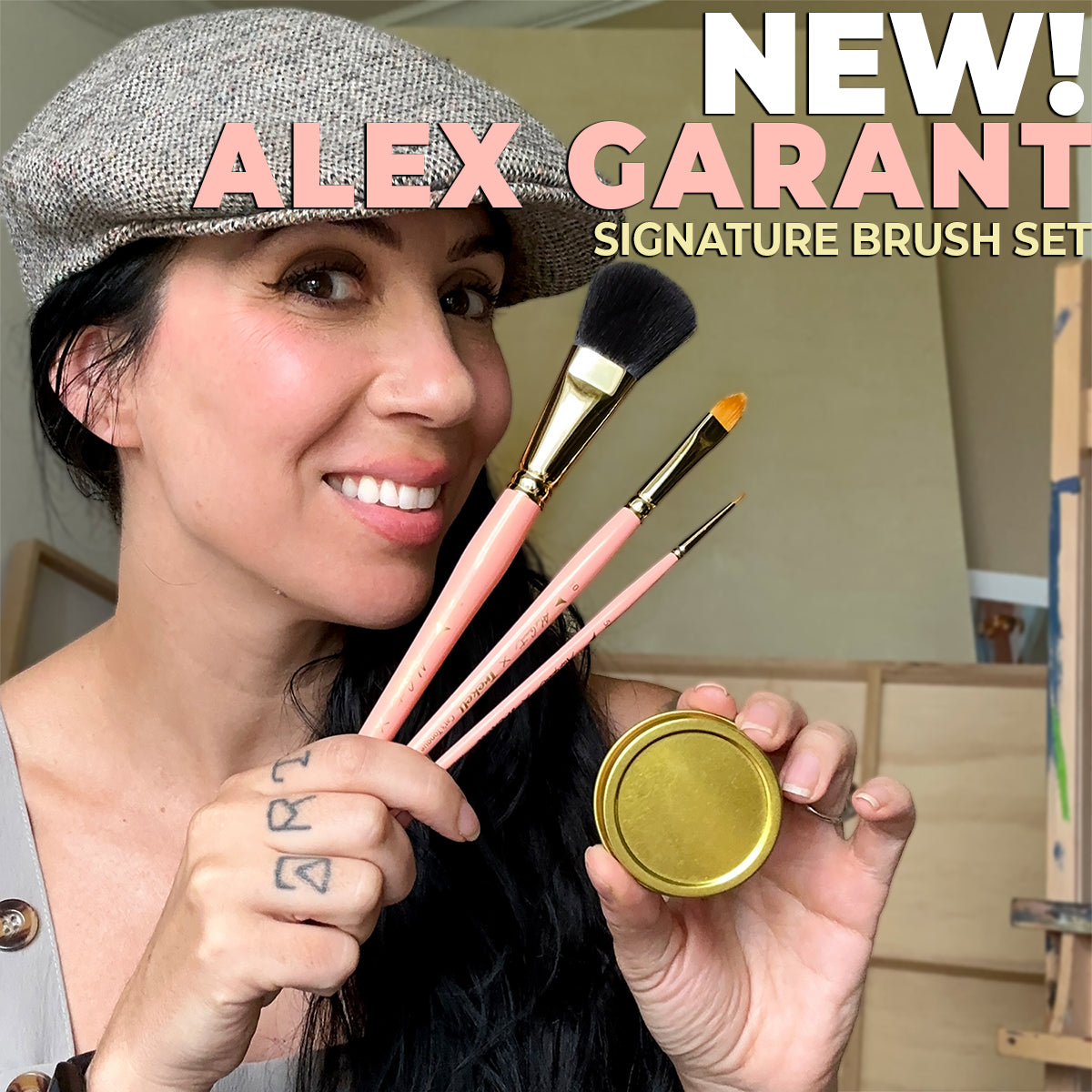 Alex Garant smiles in a gray cap, holding three pink-handled brushes and a gold tin; text announces her new brush set.