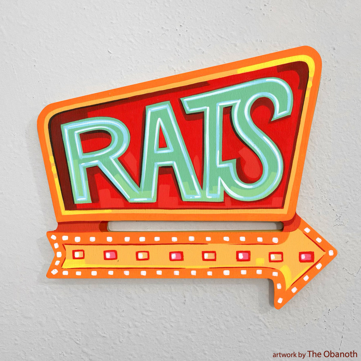 Vintage diner sign panel painted red with green RATS lettering and an orange arrow.