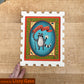 Postage-stamp panel painted with a black-and-white animal on a blue oval, credited to Lizzy Gass.