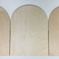 Trekell Gothic Rounded Arch Altar Panel lying flat, with both curved doors open and wood grain visible across all three sections.