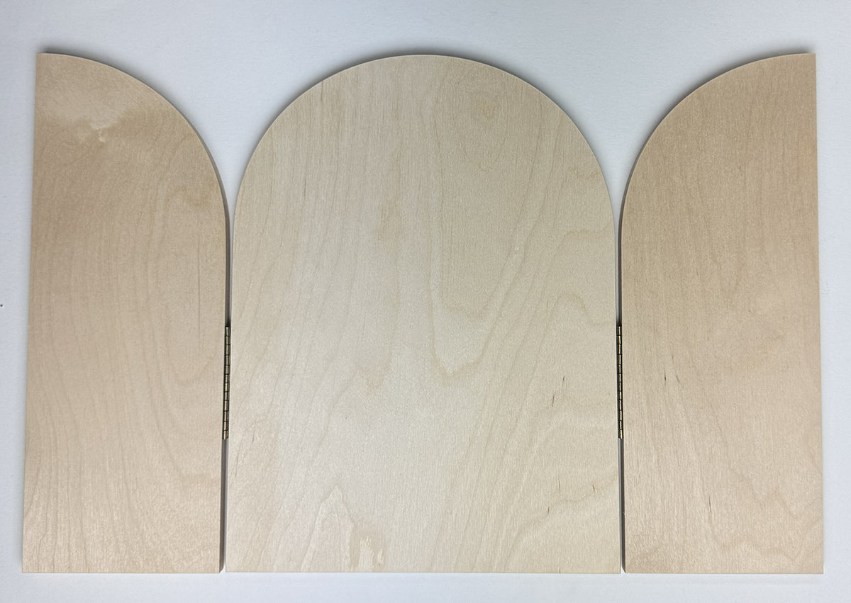 Trekell Gothic Rounded Arch Altar Panel lying flat, with both curved doors open and wood grain visible across all three sections.