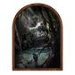 Dark forest painting with a skull-like formation above water in a rounded arch frame.