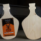 Two unfinished wooden painting panels shaped like potion bottles, with Trekell labels.