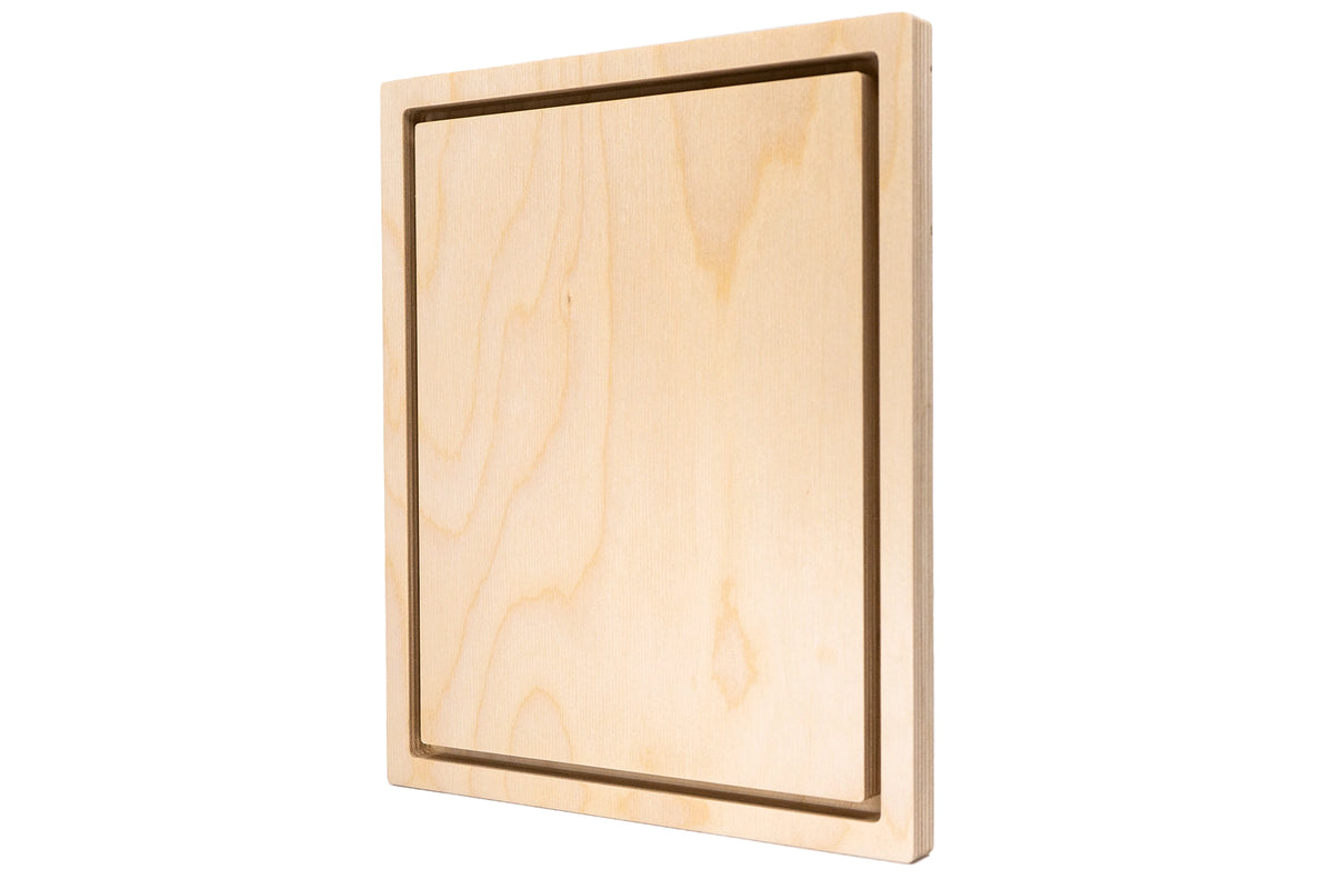 Square wooden floater panel at an angle, showing the inset center and frame thickness.