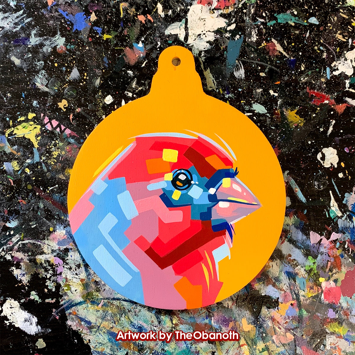 Faceted red-and-blue bird head painted on a yellow round ornament panel.