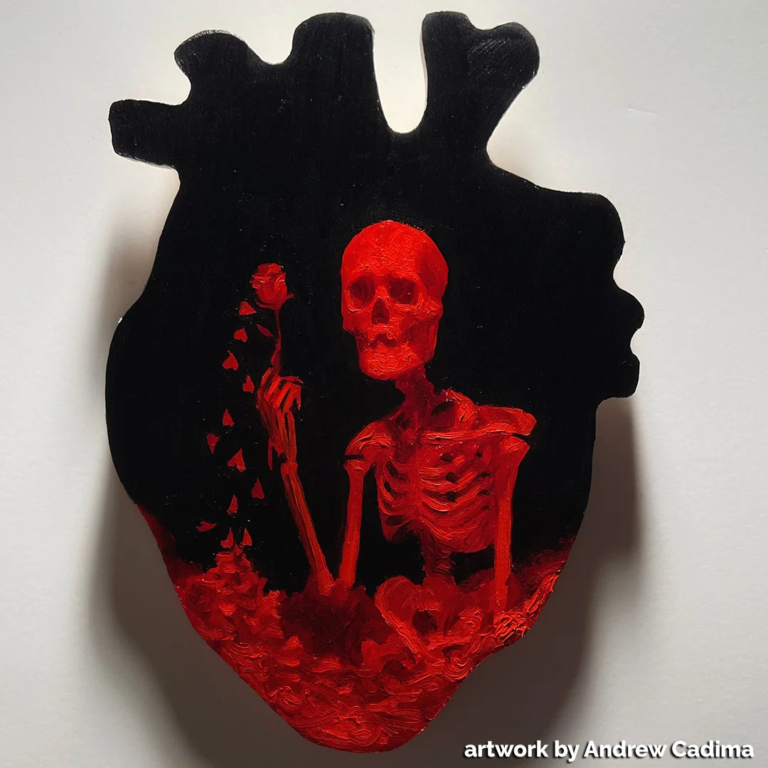 Red skeleton and flowers painted on a black anatomical-heart panel.